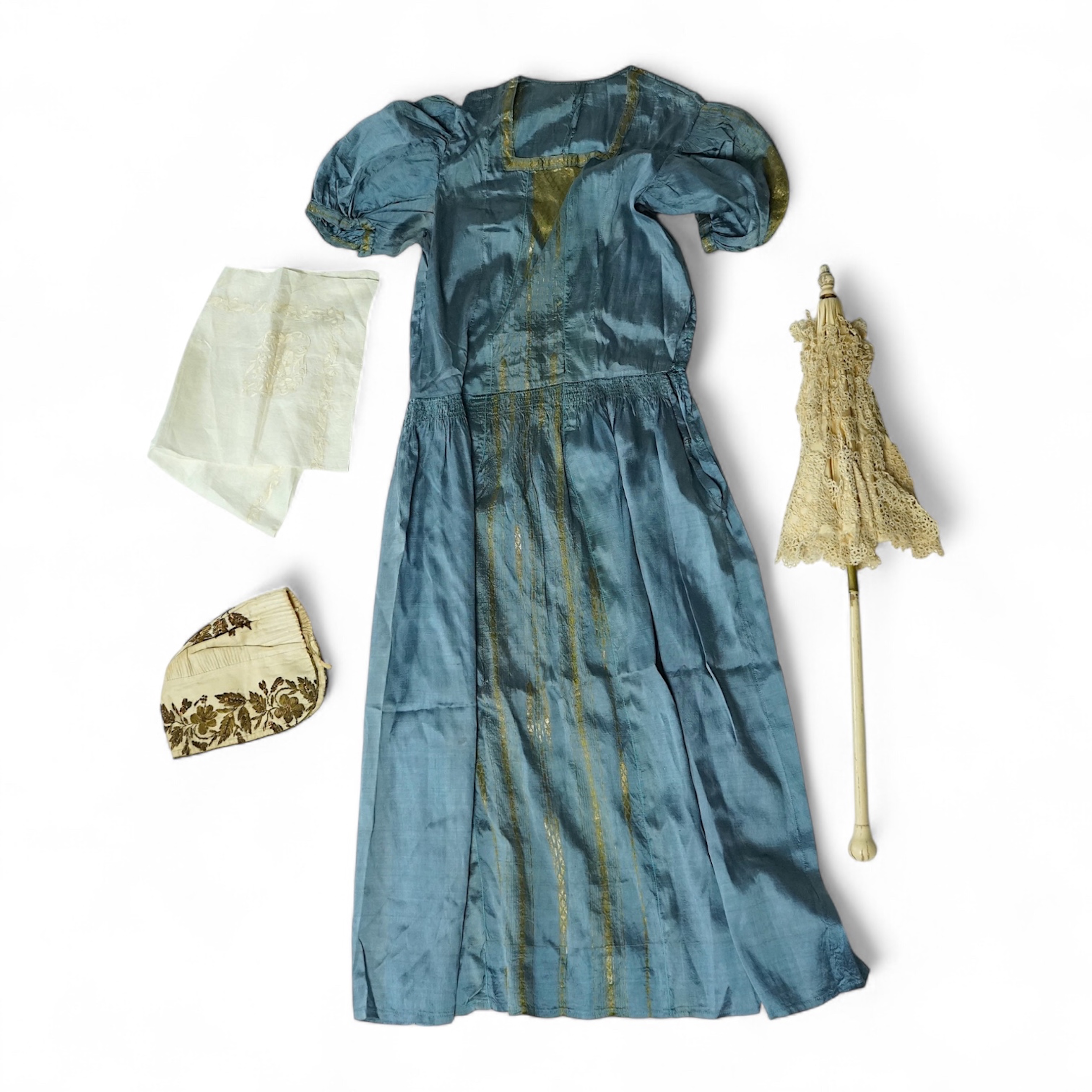 An early 19th century cream silk and metal thread embroidered ladies bonnet, an interesting 1930’s blue silk and gold thread dress fabric designed with Secessionist influences, an earlier fine linen silk embroidered kerc